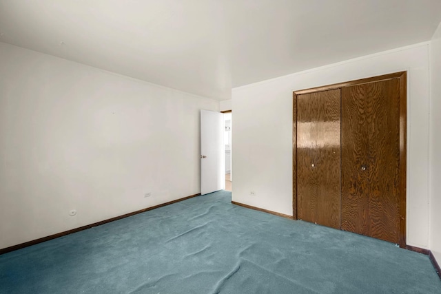 unfurnished bedroom featuring carpet floors and a closet