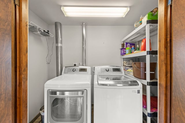 laundry area featuring laundry area and washer and clothes dryer