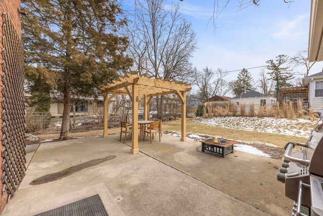 view of patio featuring a fire pit, outdoor dining area, a fenced backyard, and a pergola