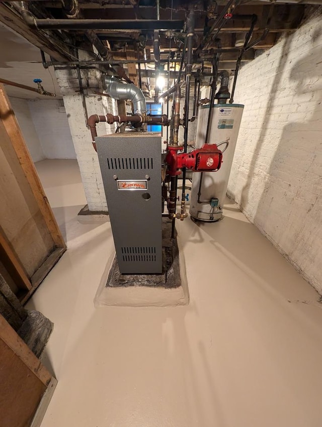 utility room with heating unit and gas water heater