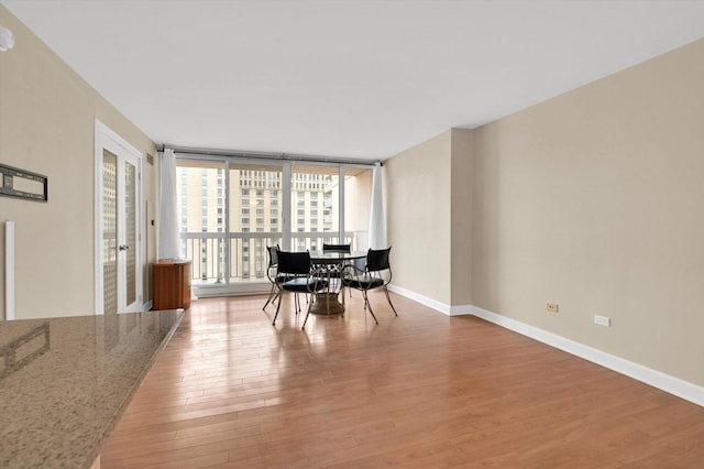 unfurnished dining area featuring hardwood / wood-style floors