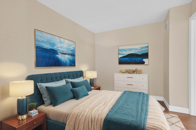 bedroom with wood-type flooring