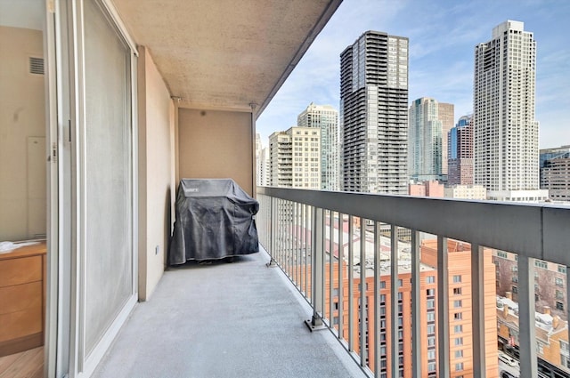 balcony featuring area for grilling