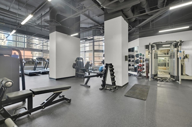 workout area featuring a high ceiling