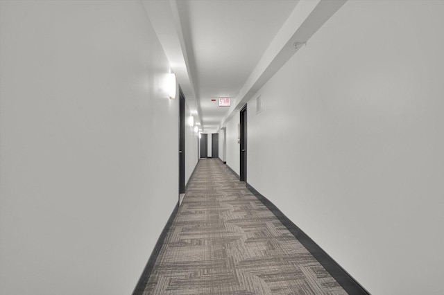 hallway featuring carpet flooring