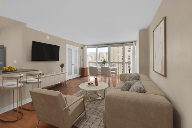 living room featuring expansive windows and dark hardwood / wood-style floors