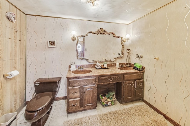 bathroom featuring crown molding, vanity, toilet, and tile patterned flooring