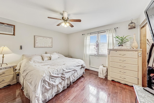 bedroom featuring dark wood-type flooring, a wall mounted AC, ceiling fan, and baseboard heating