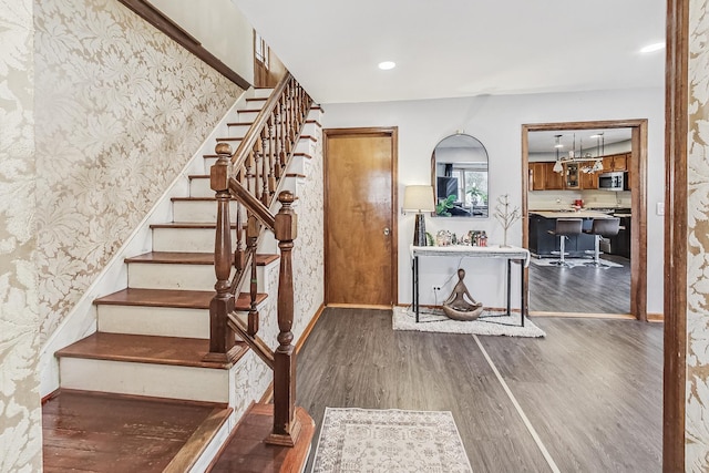 stairway with wood-type flooring