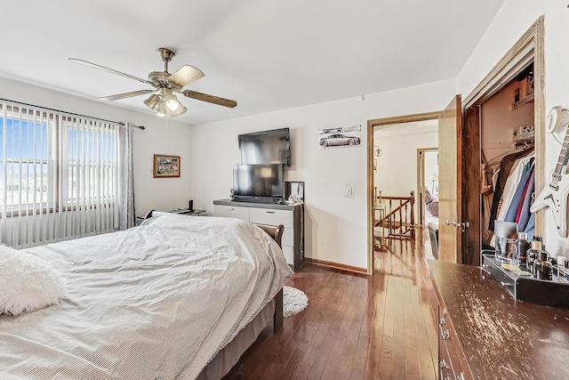 bedroom featuring dark wood-type flooring and ceiling fan