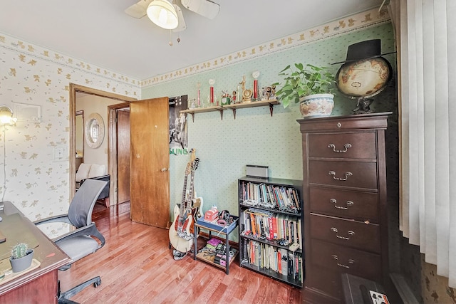 home office with ceiling fan and light wood-type flooring