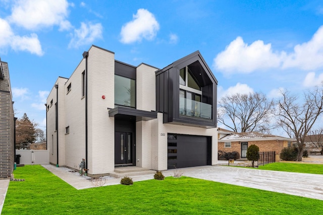 contemporary home with driveway, an attached garage, fence, a front lawn, and brick siding