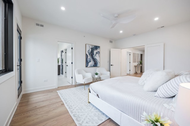 bedroom featuring light wood-style flooring, visible vents, and recessed lighting