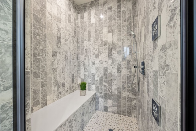 full bath featuring tiled shower