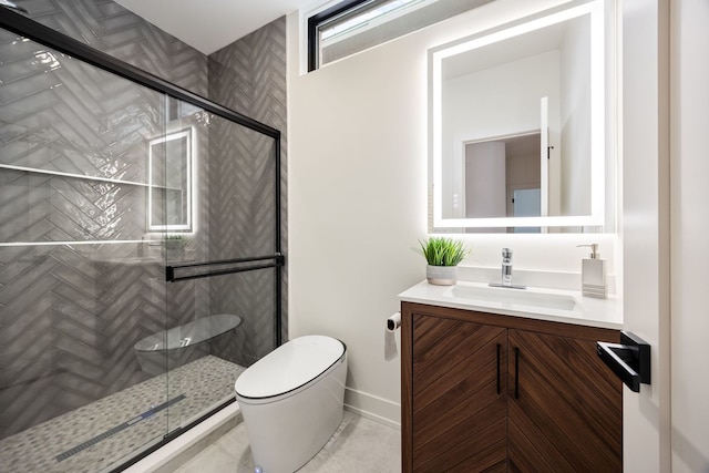 bathroom featuring baseboards, vanity, toilet, and a shower stall