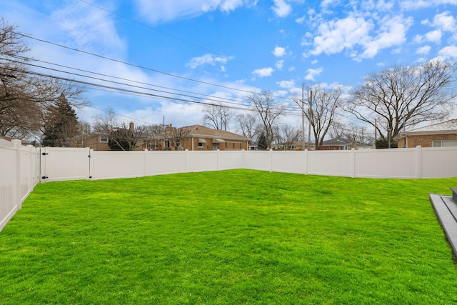 view of yard featuring a fenced backyard