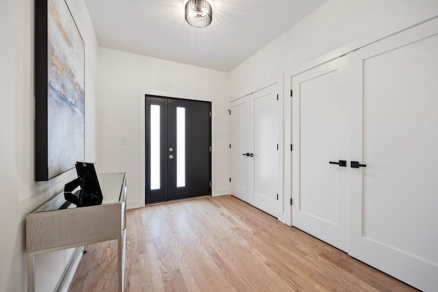 foyer entrance featuring light wood-type flooring