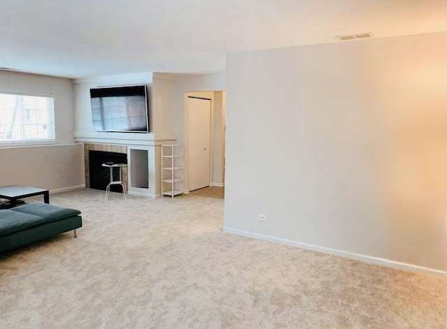 unfurnished living room with light carpet