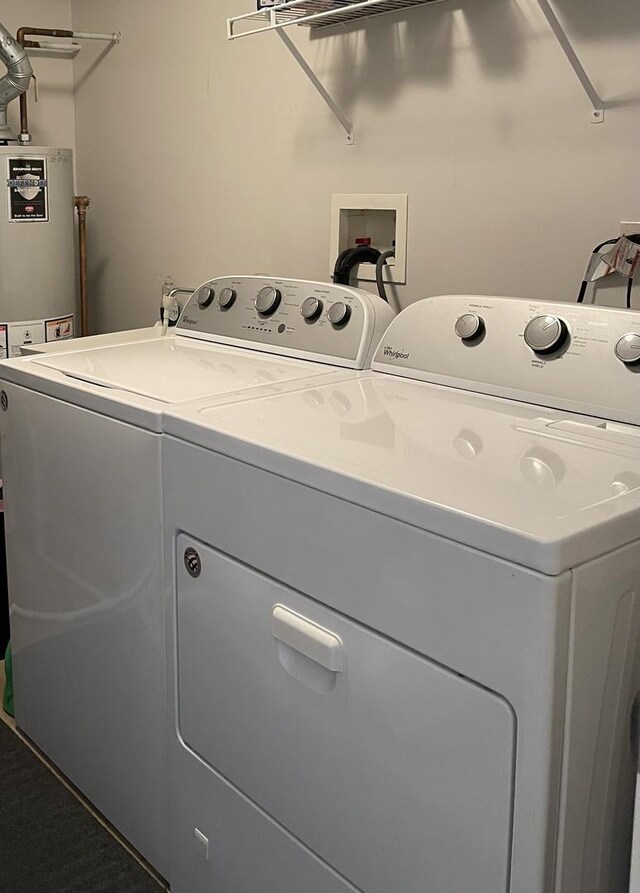 laundry area with separate washer and dryer and gas water heater