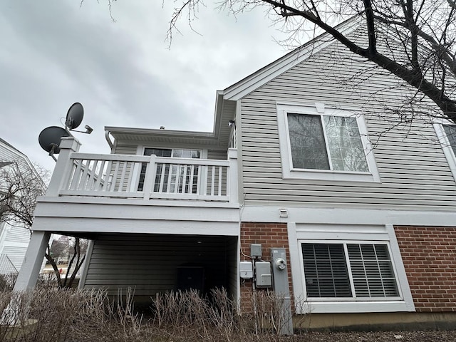 back of house with a balcony