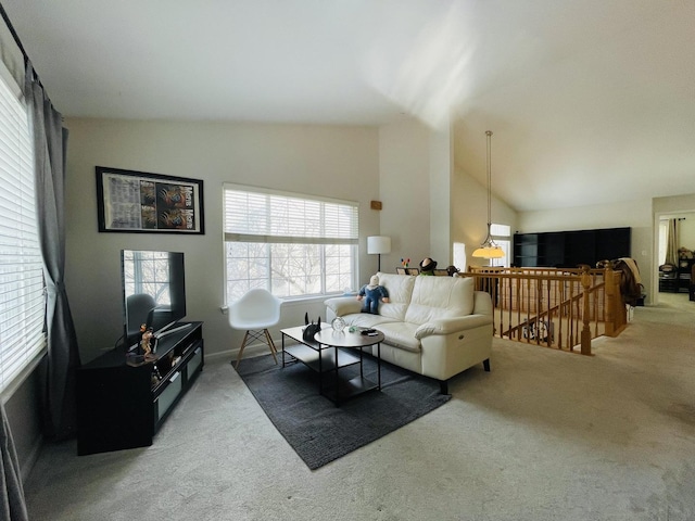 carpeted living room featuring high vaulted ceiling