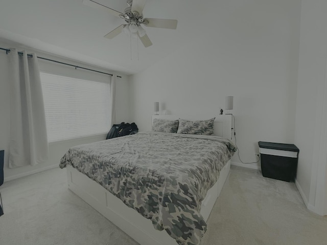 bedroom with ceiling fan and light carpet