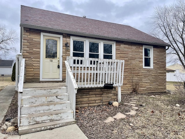 view of front of home featuring roof with shingles