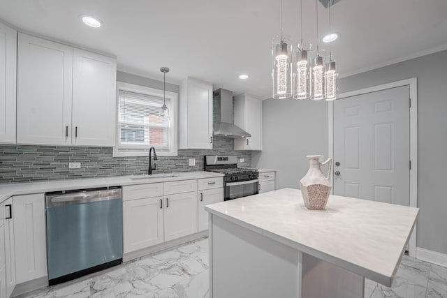 kitchen with sink, stainless steel appliances, white cabinets, and wall chimney exhaust hood