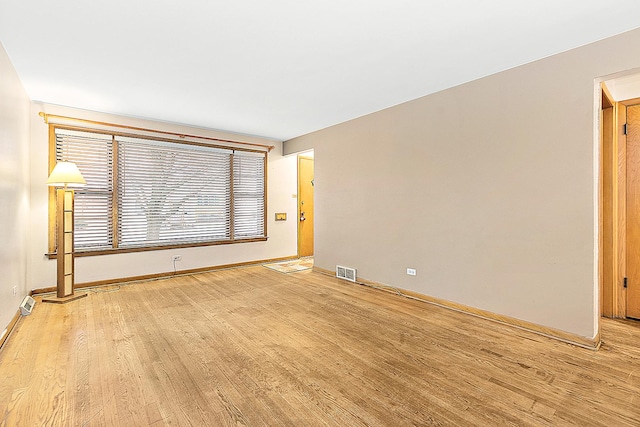 spare room with light wood-type flooring