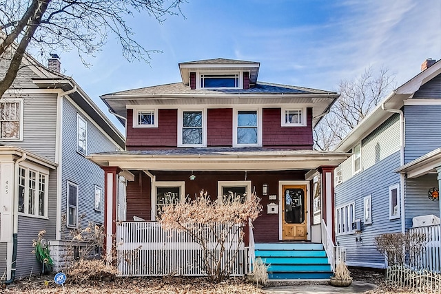 traditional style home featuring covered porch