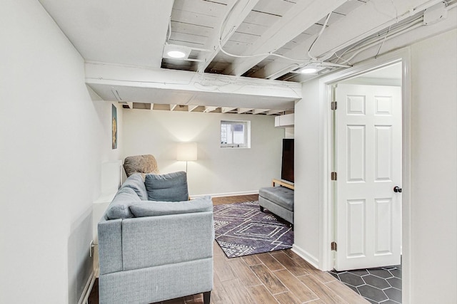 sitting room featuring wood finish floors and baseboards