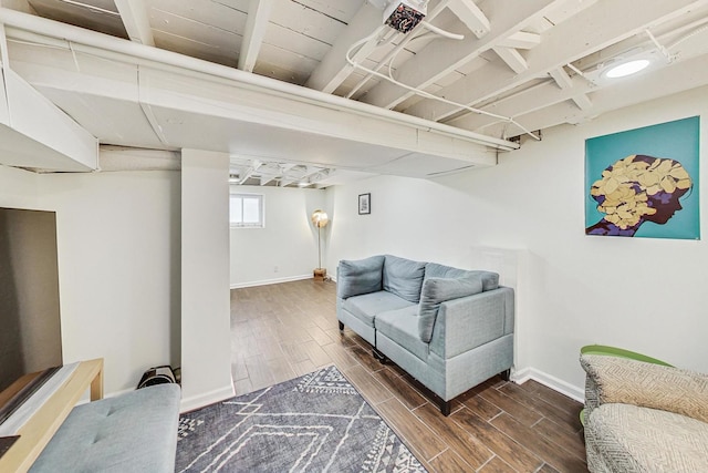 living room with wood tiled floor and baseboards