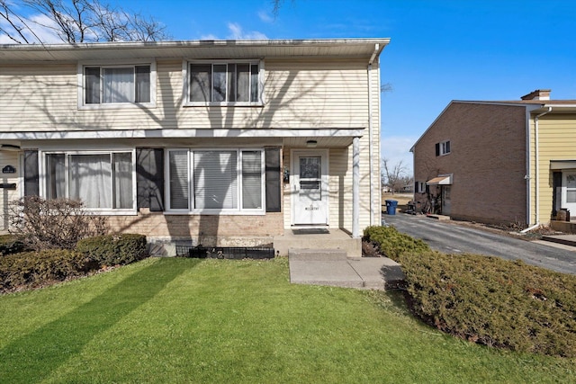 view of front of home with a front lawn