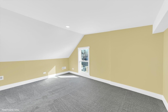 bonus room with carpet floors, lofted ceiling, recessed lighting, visible vents, and baseboards