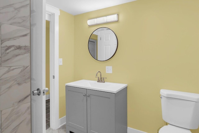 bathroom with toilet and vanity