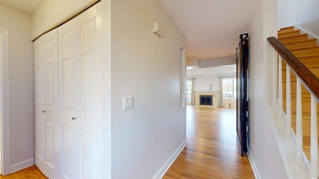 hallway with light wood-type flooring