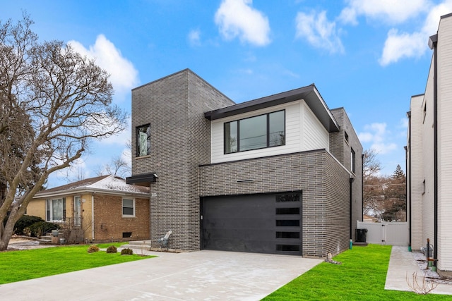 modern home featuring a garage, a gate, brick siding, and a front lawn