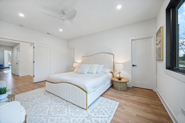 bedroom with recessed lighting, a ceiling fan, baseboards, visible vents, and light wood finished floors