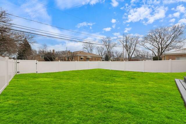 view of yard with a fenced backyard