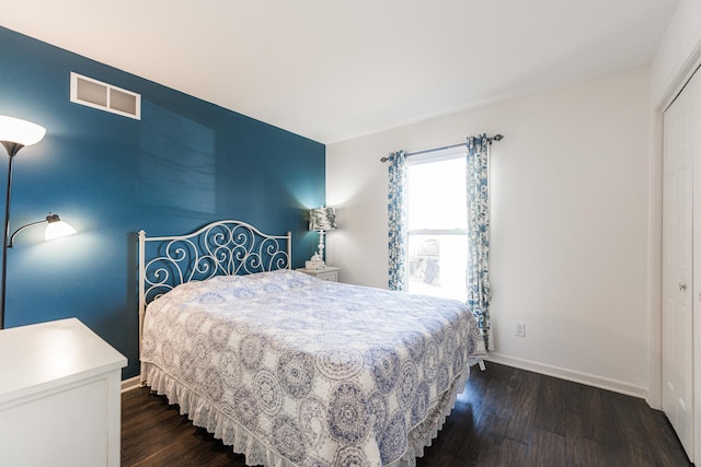 bedroom featuring dark hardwood / wood-style flooring