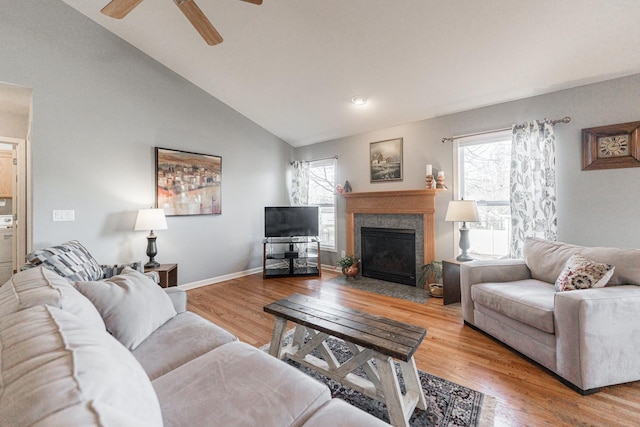 living room with high vaulted ceiling, light hardwood / wood-style flooring, and ceiling fan