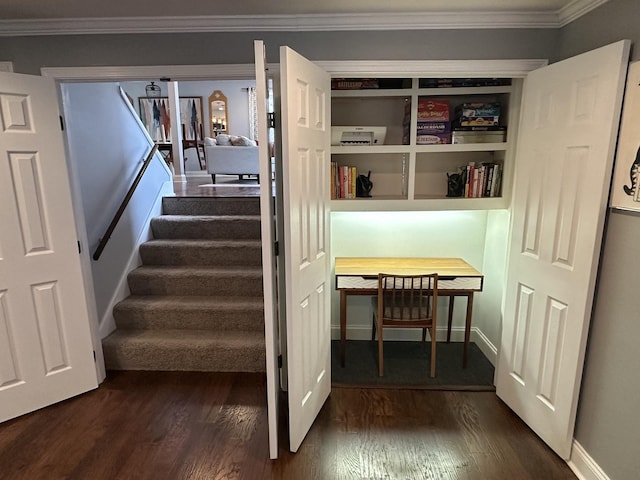 stairway with hardwood / wood-style flooring and crown molding