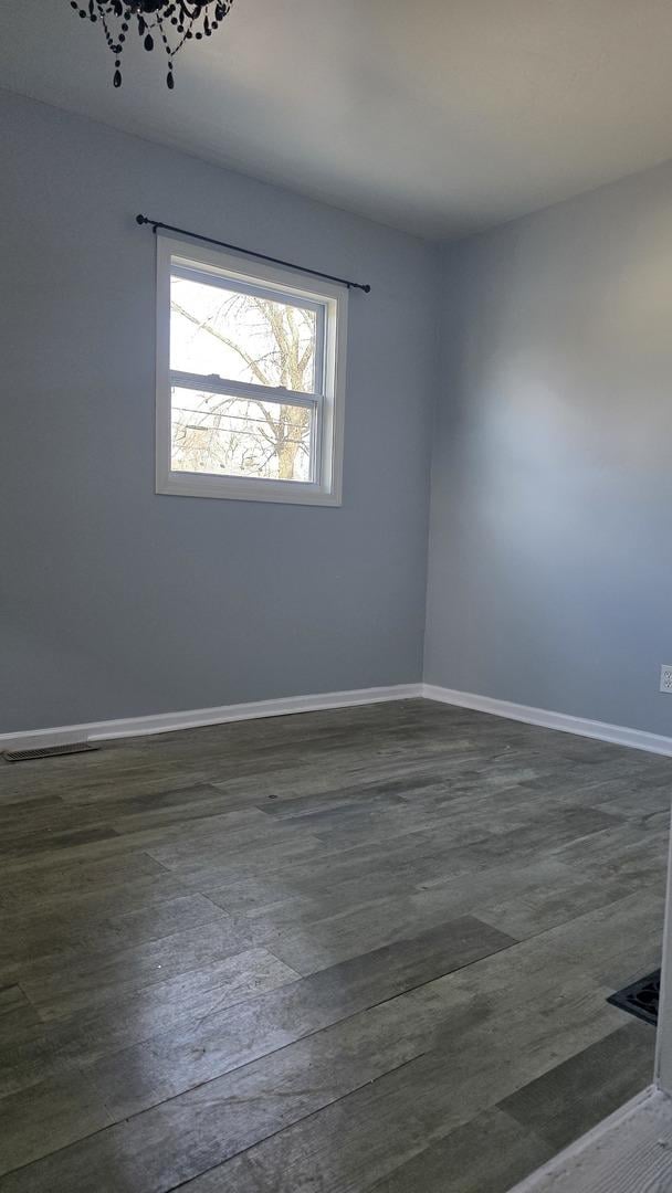 empty room featuring dark hardwood / wood-style floors