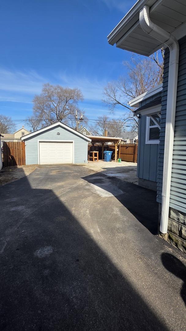 exterior space with an outbuilding and a garage