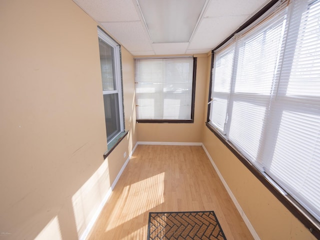 sunroom / solarium with a paneled ceiling and visible vents