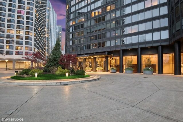 view of outdoor building at dusk