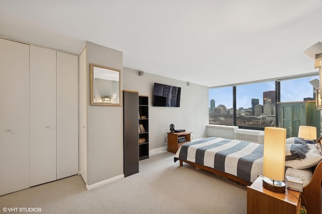 bedroom featuring light carpet