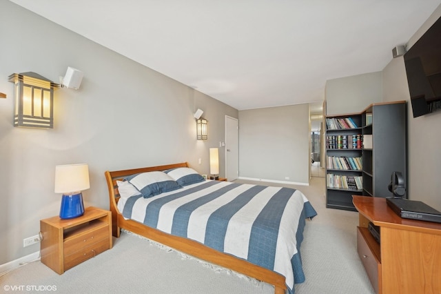 bedroom featuring light colored carpet