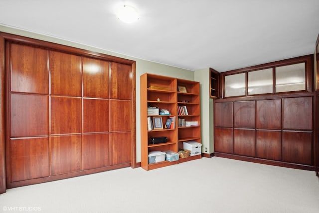 unfurnished bedroom featuring light carpet