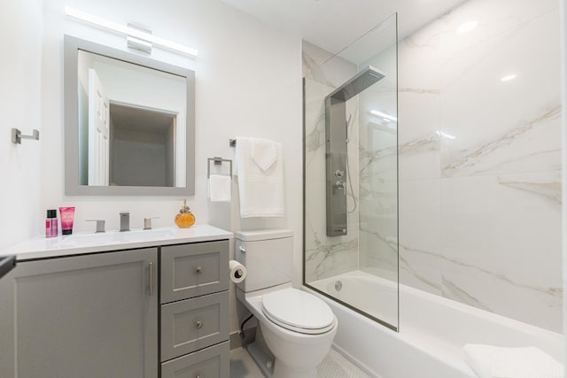 full bathroom with tiled shower / bath combo, vanity, and toilet